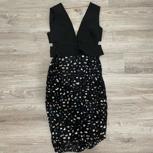 BCBG size 2, dress with side cut outs and deep v front.